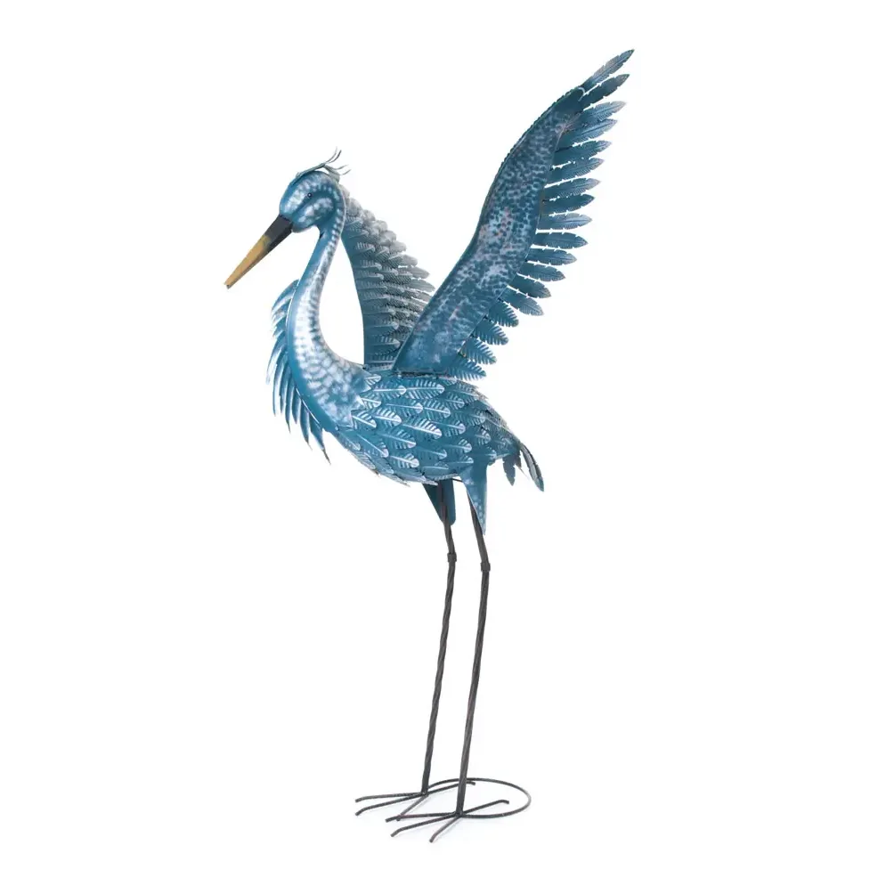 A garden ornament heron photographed against a white background