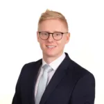 A staff portrait taken for a man working in a Sussex Business