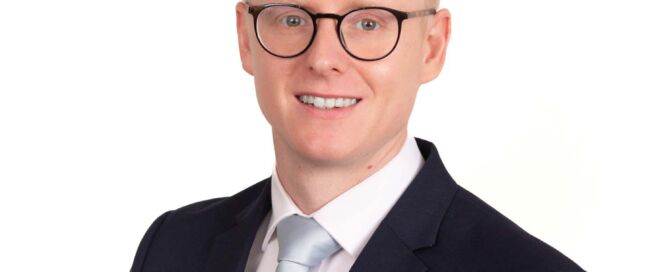 A staff portrait taken for a man working in a Sussex Business